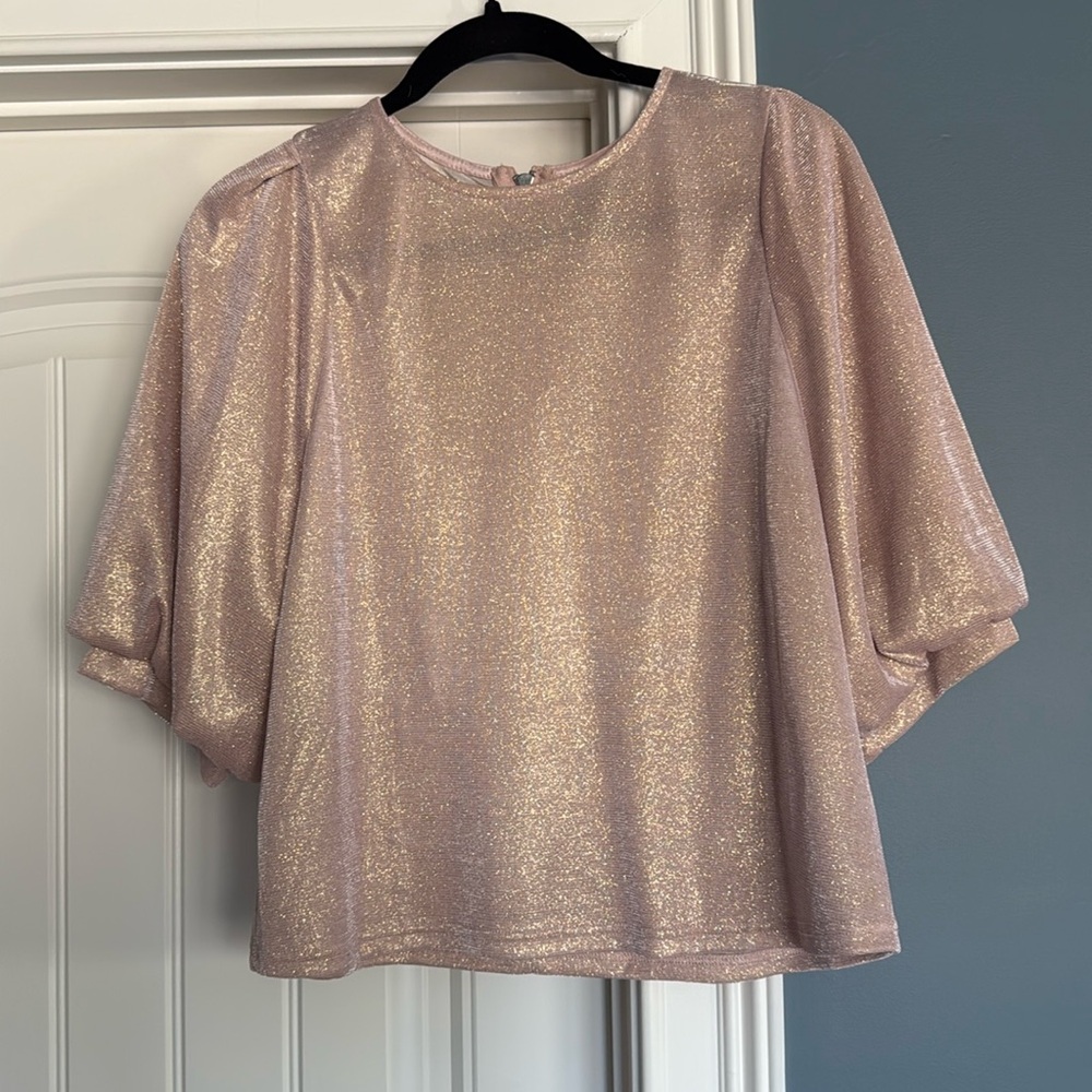 Shiny pink/gold top.
